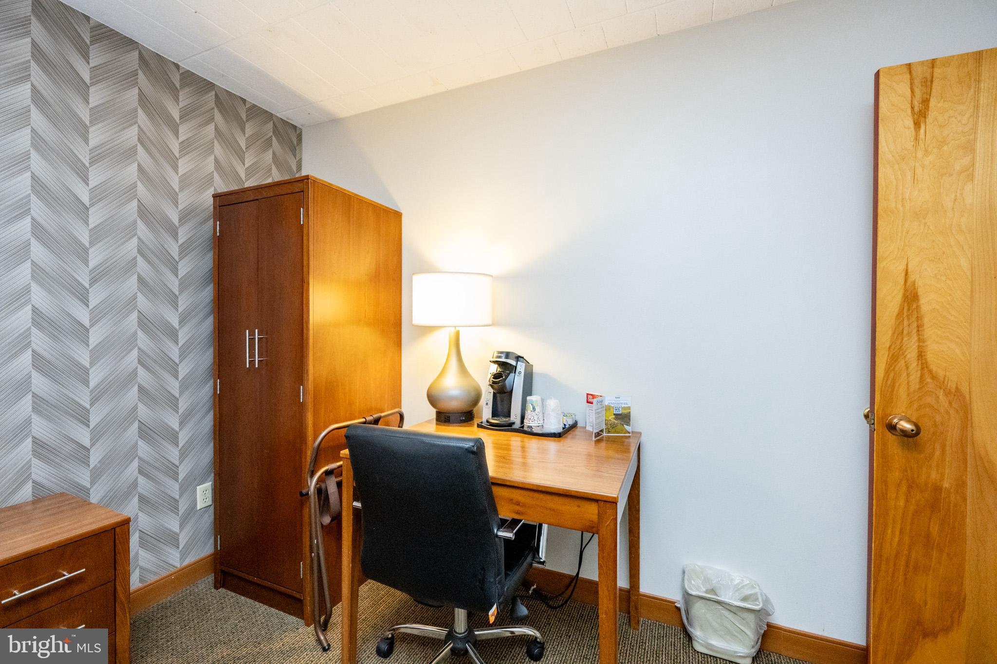 290 Marsh Hill Road, Unit 702K McHenry, MD 21541 - Photo 4 of 45 a view of a workspace with furniture and wooden floor