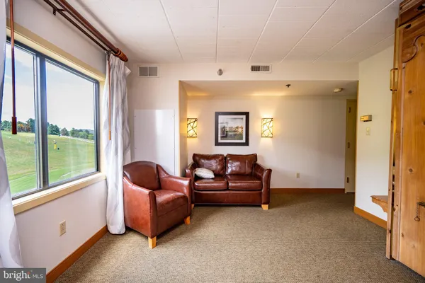 a living room with furniture and a window