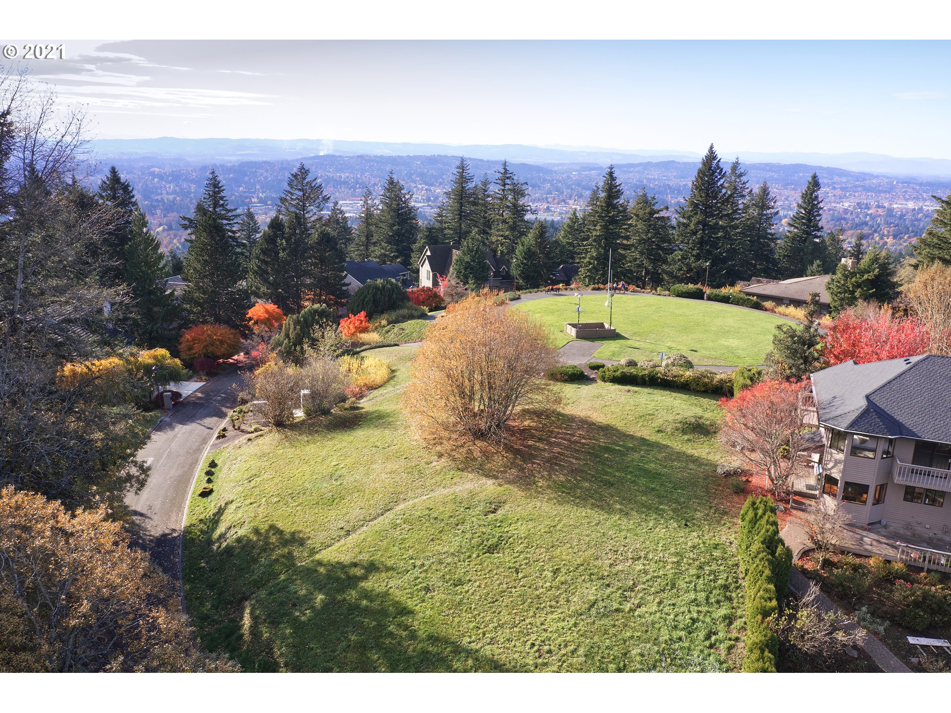 Nansen Summit Lake Oswego, OR 97035 - Photo 4 of 21 a view of a swimming pool with a yard and mountain view in back