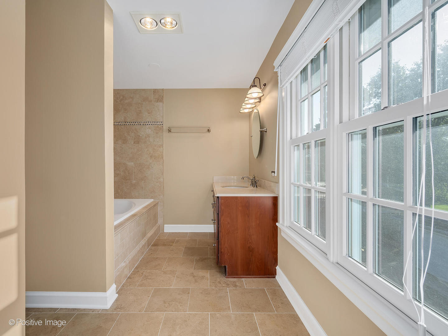 232 Middaugh Road Clarendon Hills, IL 60514 - Photo 12 of 24 a bathroom with a tub shower and mirror