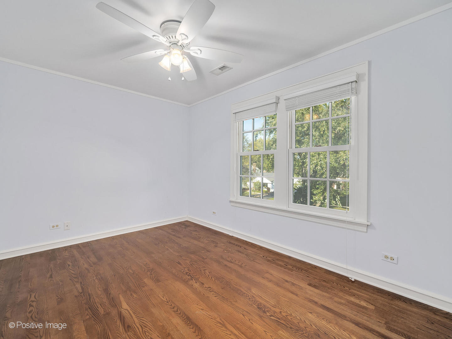232 Middaugh Road Clarendon Hills, IL 60514 - Photo 13 of 24 an empty room with a window and a fan