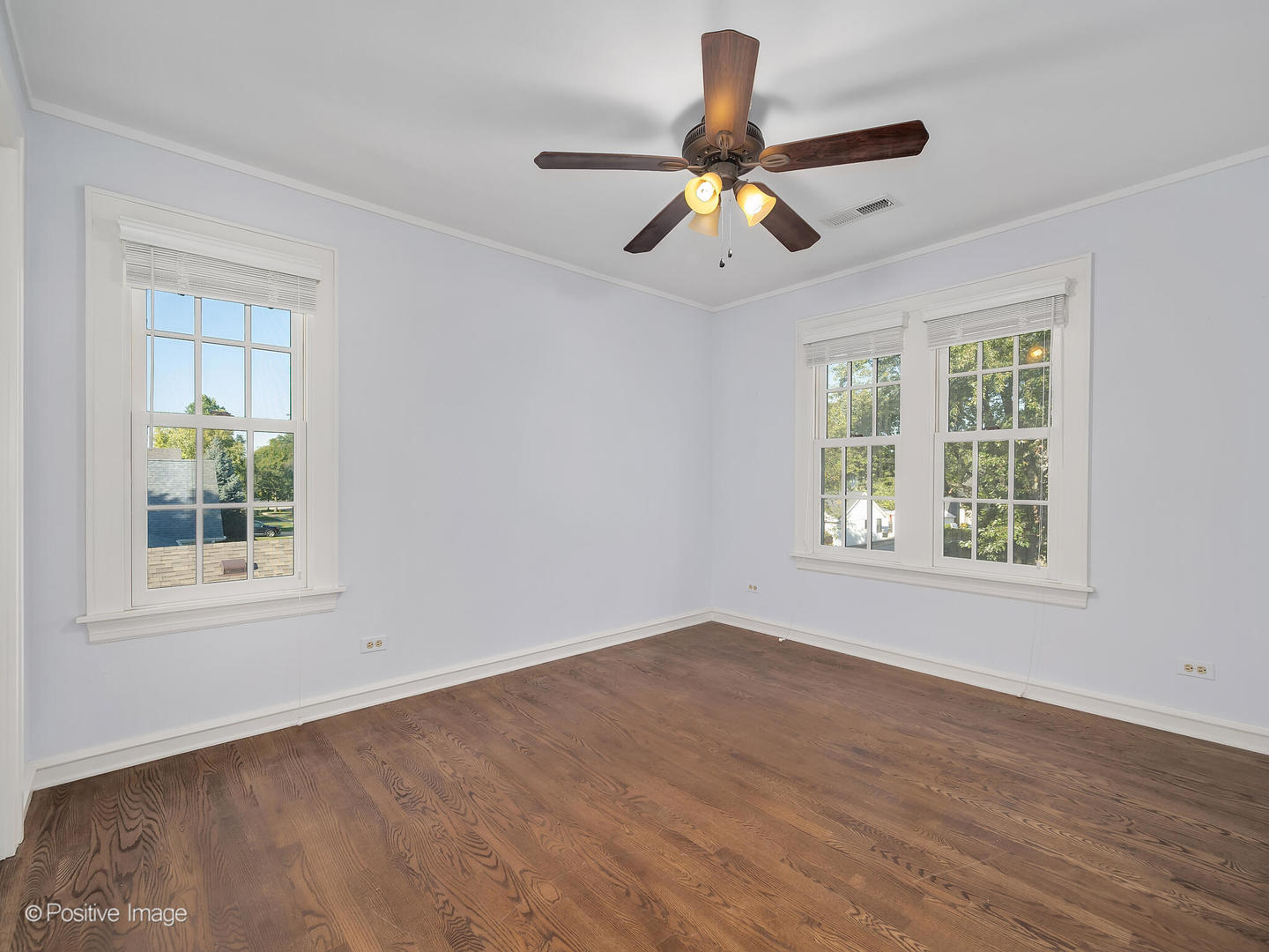 232 Middaugh Road Clarendon Hills, IL 60514 - Photo 14 of 24 a view of an empty room with wooden floor and a window