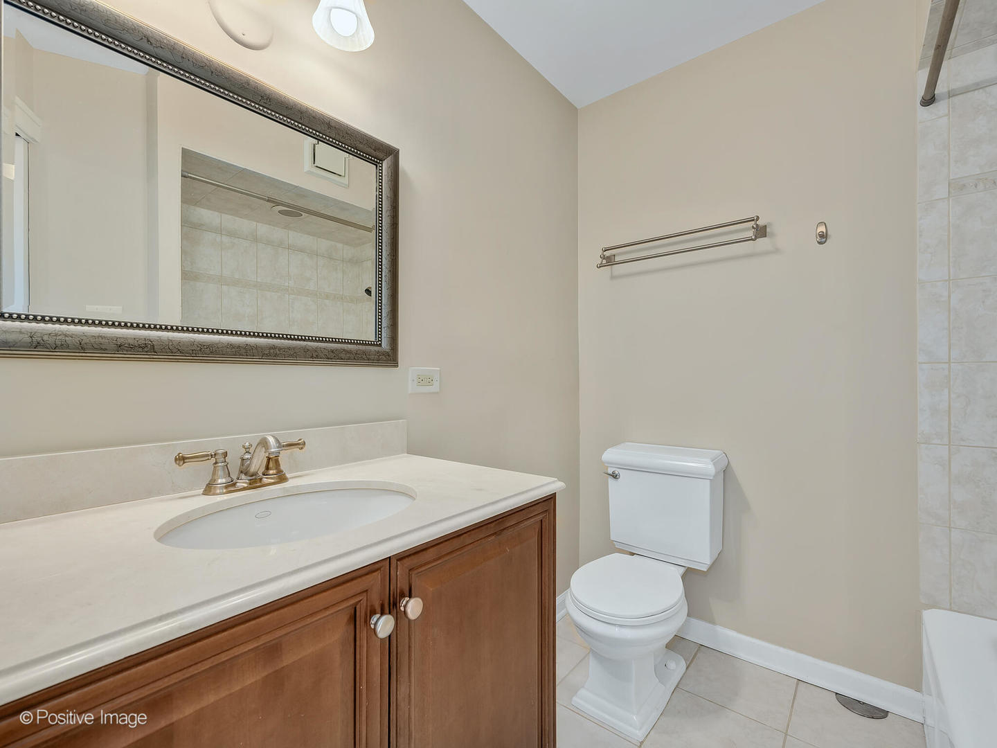 232 Middaugh Road Clarendon Hills, IL 60514 - Photo 15 of 24 a bathroom with a sink a toilet and mirror