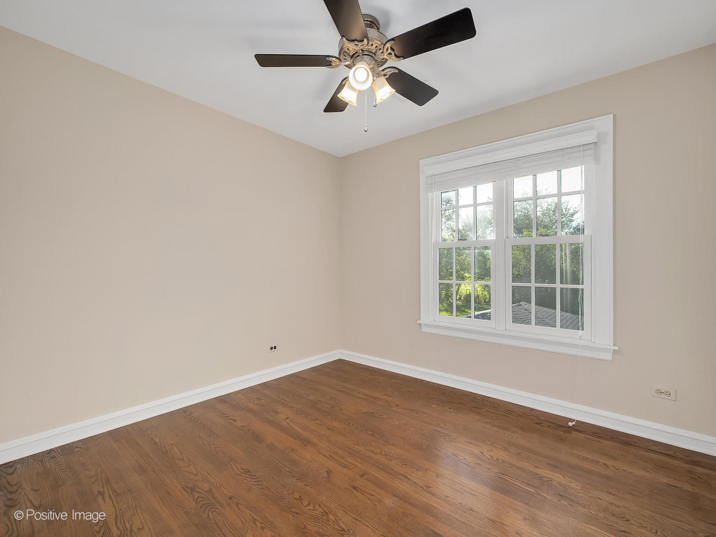232 Middaugh Road Clarendon Hills, IL 60514 - Photo 16 of 24 an empty room with wooden floor and windows