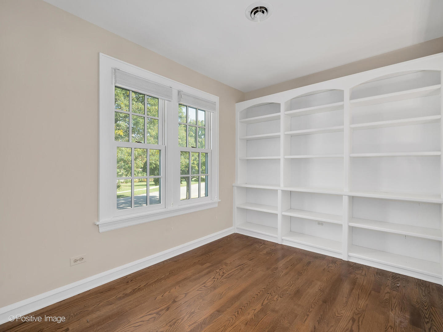 232 Middaugh Road Clarendon Hills, IL 60514 - Photo 17 of 24 wooden floor in an empty room with a window