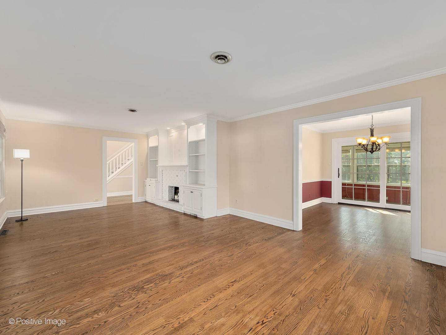 232 Middaugh Road Clarendon Hills, IL 60514 - Photo 6 of 24 a view of empty room with wooden floor and fan