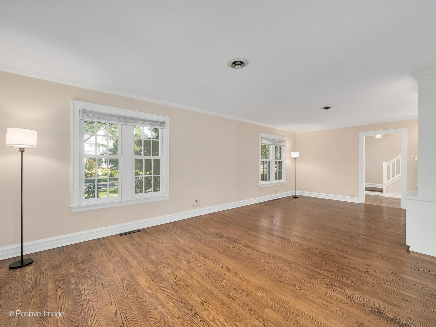 232 Middaugh Road Clarendon Hills, IL 60514 - Photo 7 of 24 a view of an empty room with wooden floor and a window