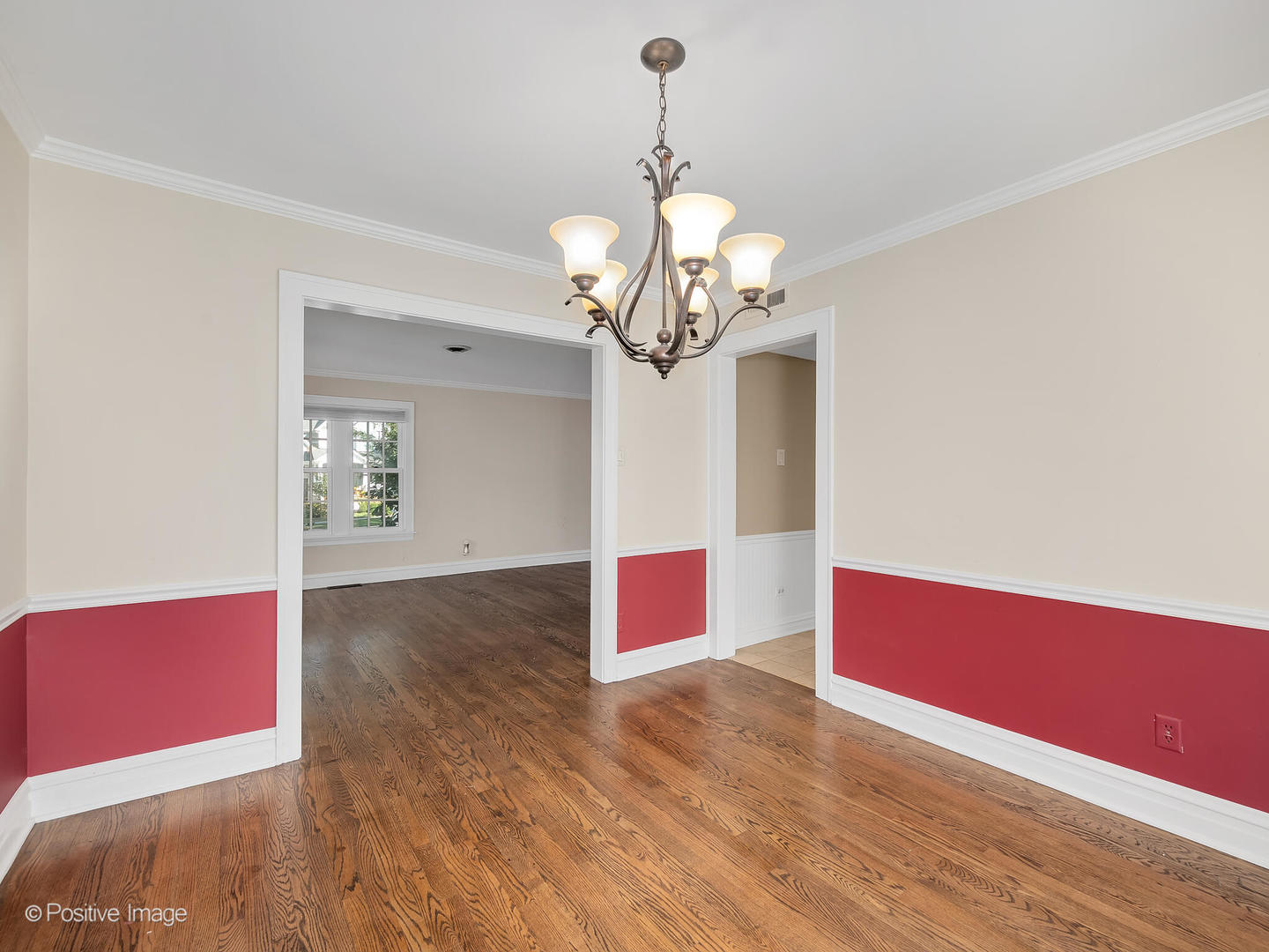 232 Middaugh Road Clarendon Hills, IL 60514 - Photo 9 of 24 a view of a room with wooden floor and chandelier