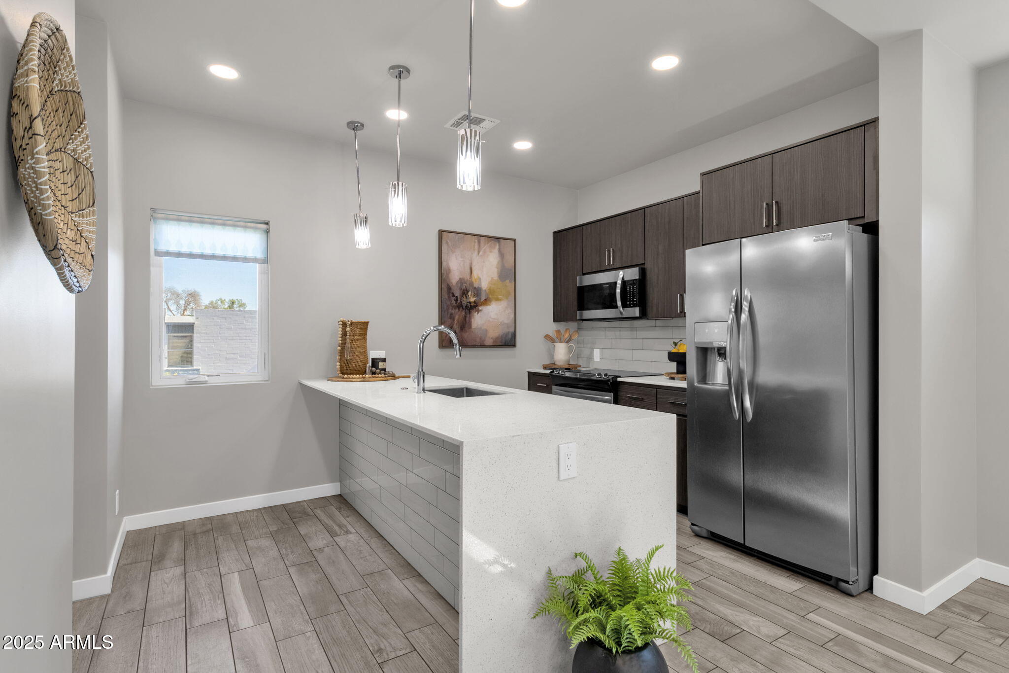 2727 East Thomas Road, Unit 9 Phoenix, AZ 85016 - Photo 15 of 46 a kitchen with a refrigerator a sink and a stove top oven