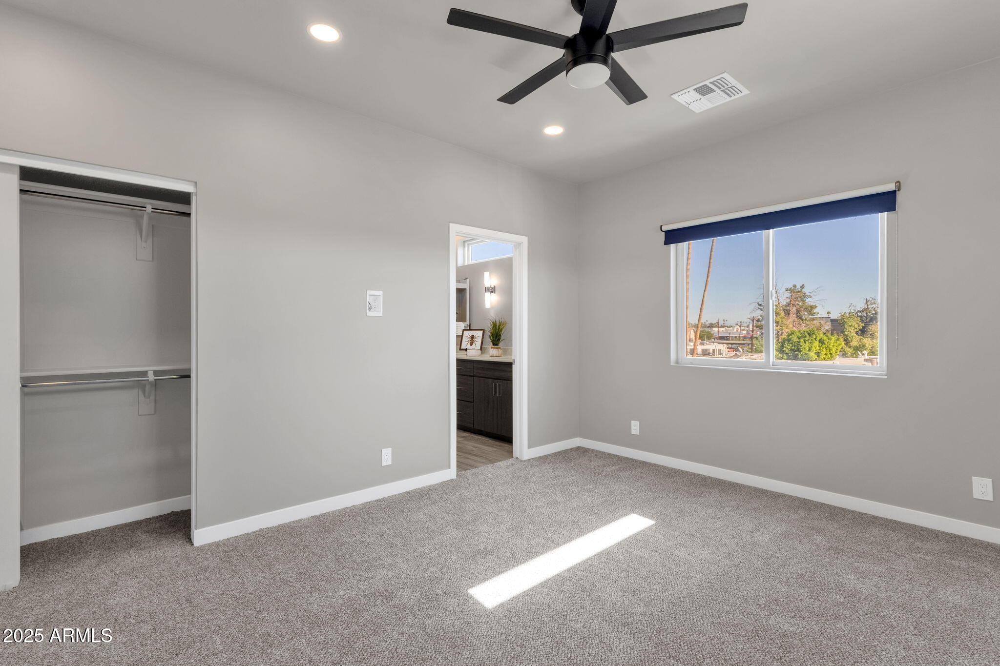 2727 East Thomas Road, Unit 9 Phoenix, AZ 85016 - Photo 31 of 46 a view of an empty room with a window