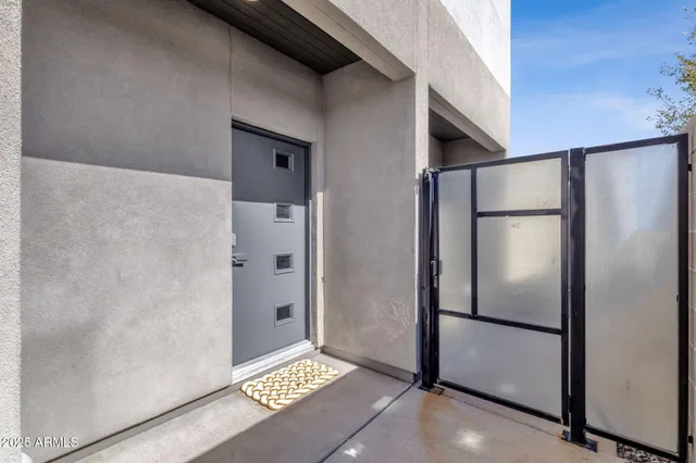 a bathroom with a glass shower door