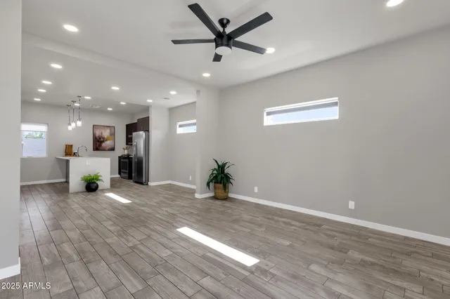 a view of a livingroom with a kitchen
