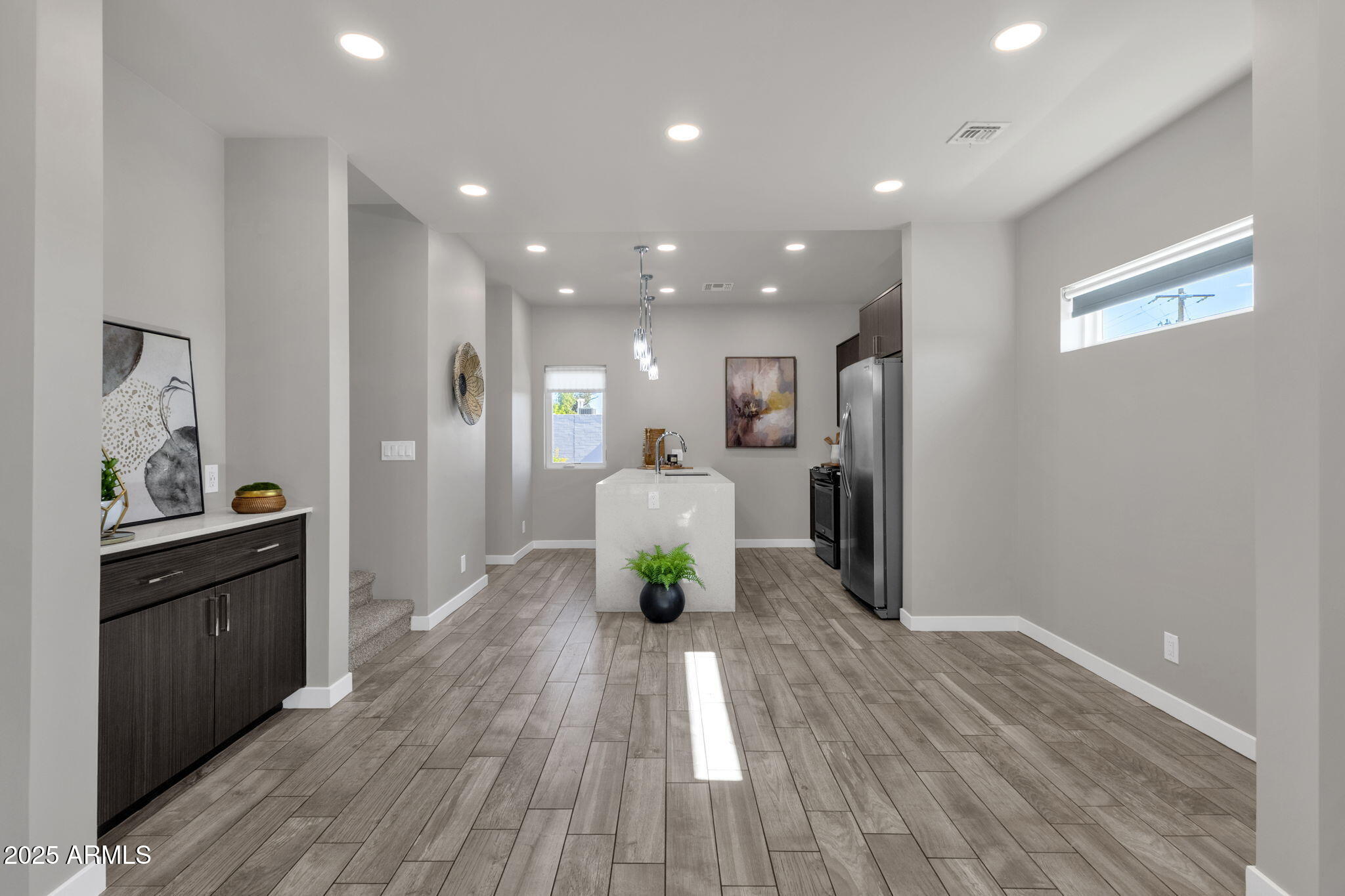 2727 East Thomas Road, Unit 9 Phoenix, AZ 85016 - Photo 8 of 46 a living room with stainless steel appliances furniture refrigerator and wooden floor