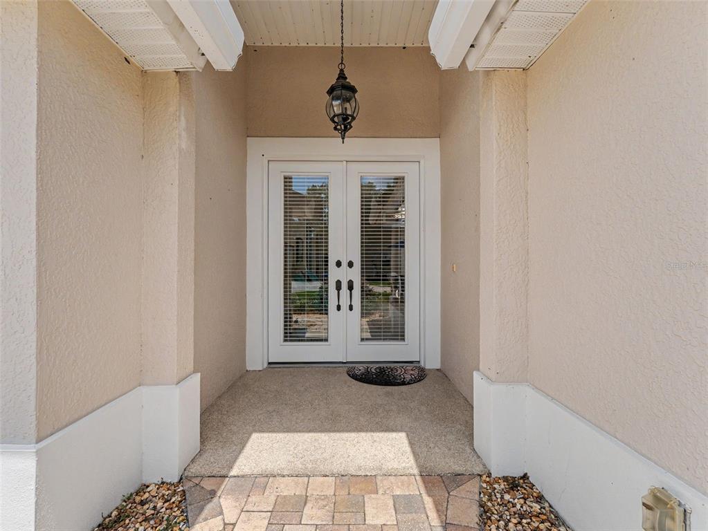 8910 Jericho Road Weeki Wachee, FL 34613 - Photo 5 of 52 a view of a hallway with windows