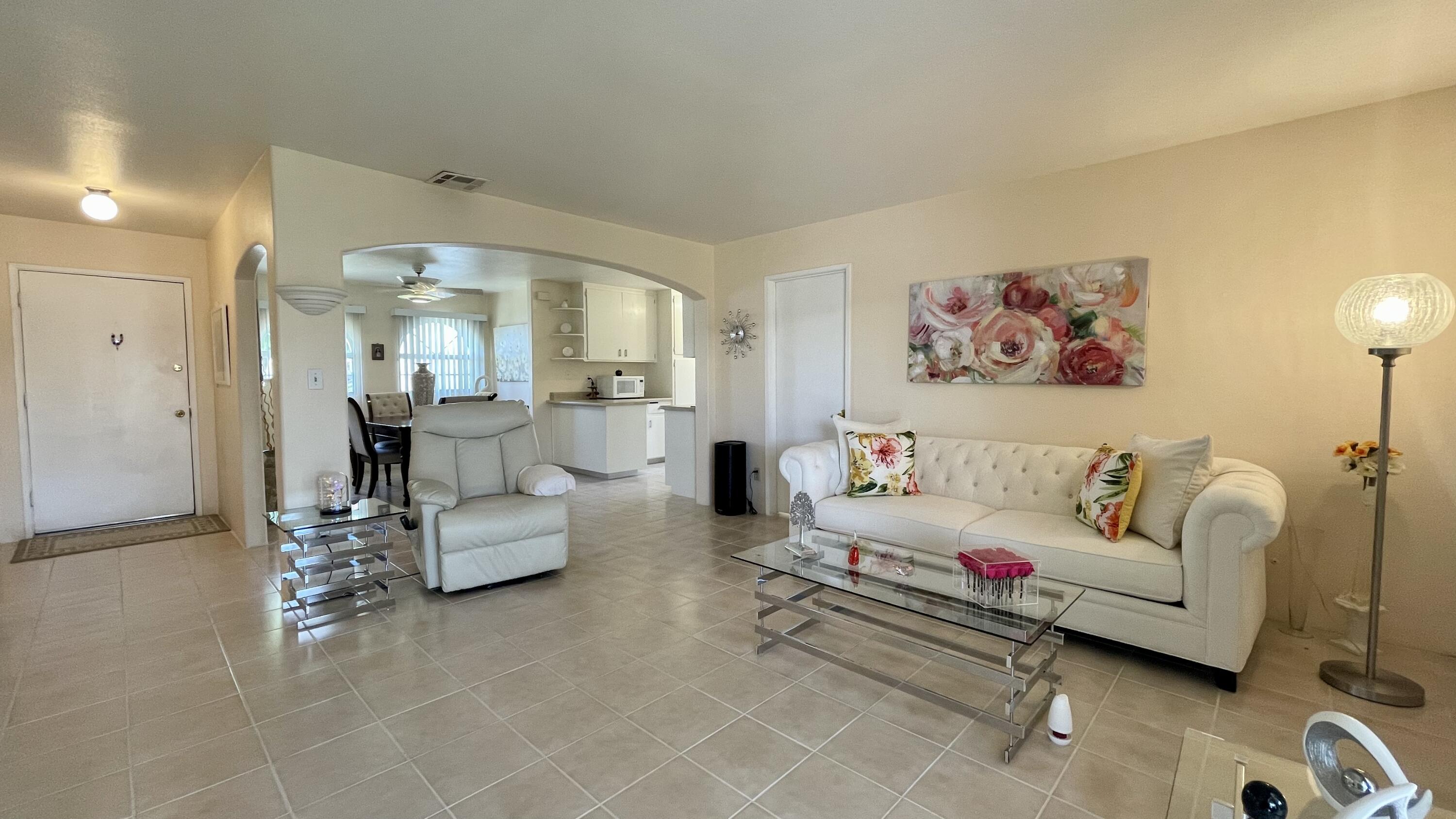 82116 Adobe Road Indio, CA 92201 - Photo 8 of 70 a living room with furniture and a table