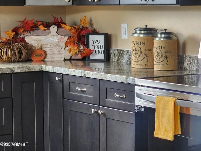 5523 Turkey Run Road Show Low, AZ 85901 - Photo 7 of 13 a kitchen with lots of clutter and cabinets