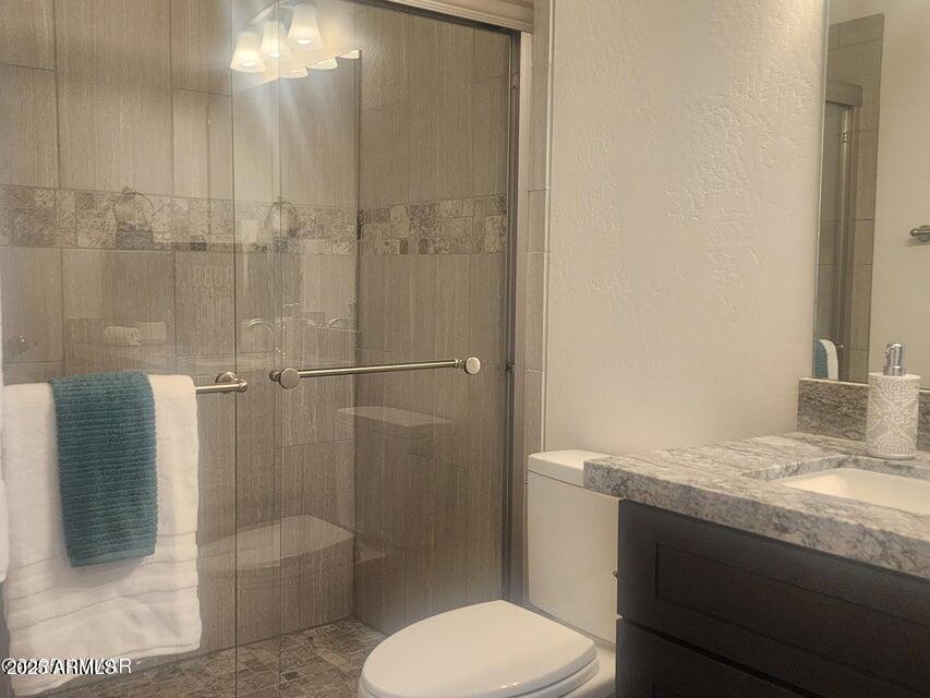 5523 Turkey Run Road Show Low, AZ 85901 - Photo 10 of 13 a bathroom with a granite countertop sink toilet and shower