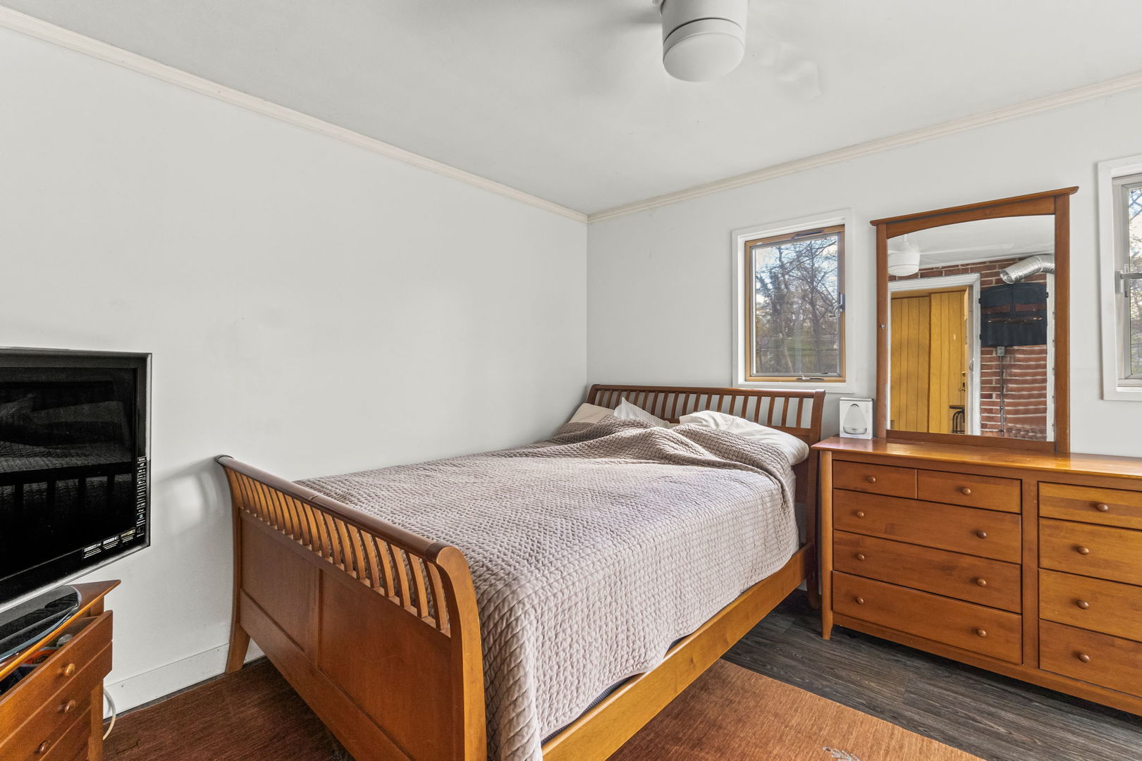 219 East Sheridan Road Lake Bluff, IL 60044 - Photo 16 of 28 a bedroom with a bed and a flat tv screen on dresser