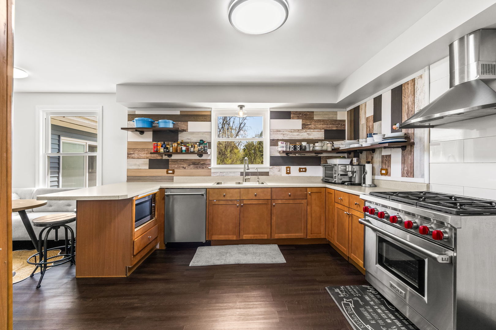 219 East Sheridan Road Lake Bluff, IL 60044 - Photo 10 of 28 a kitchen with stainless steel appliances granite countertop a stove and a sink
