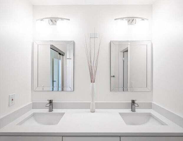 9284 Vista Del Lago, Unit 34F Boca Raton, FL 33428 - Photo 4 of 15 a bathroom with a sink and a mirror