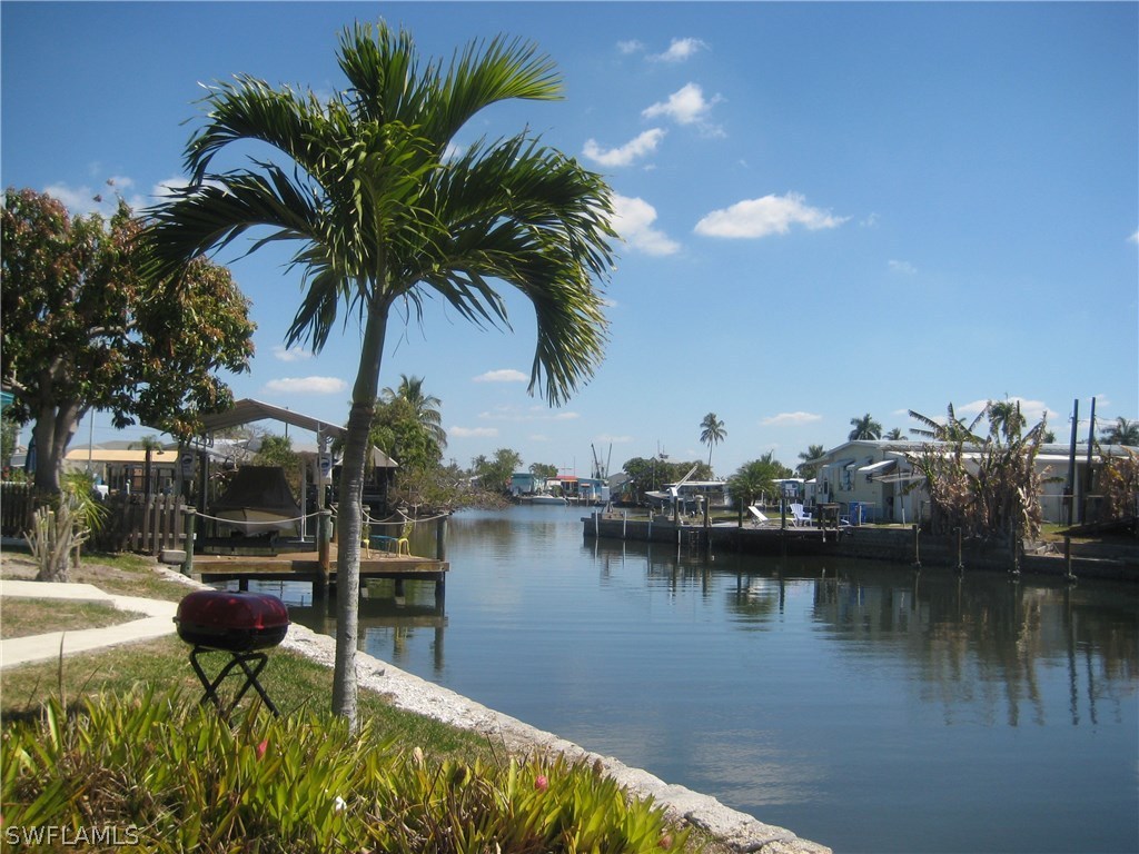 2567 Cay Cove Matlacha, FL 33993 - Photo 1 of 18 a view of a lake with a house