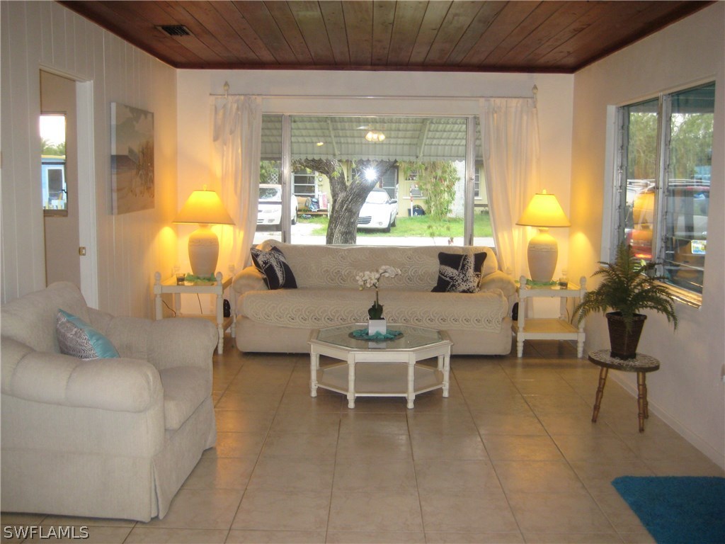 2567 Cay Cove Matlacha, FL 33993 - Photo 4 of 18 a living room with furniture and a large window