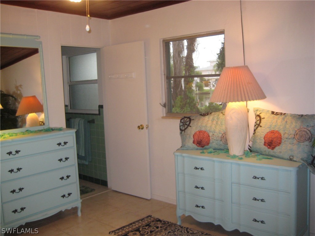 2567 Cay Cove Matlacha, FL 33993 - Photo 8 of 18 a room with a dresser and a window