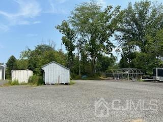 474 Highway 22 Lebanon, NJ 08833 - Photo 3 of 7 a view of backyard with table and chairs and wooden fence