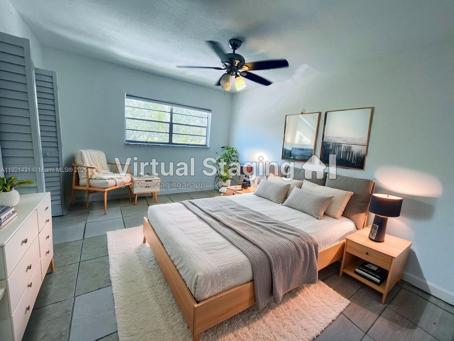825 Northwest 46th Avenue, Unit 825 Plantation, FL 33317 - Photo 5 of 12 a bedroom with bed and window