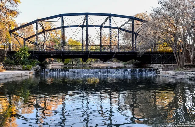 a view of swimming pool with a yard and sitting area