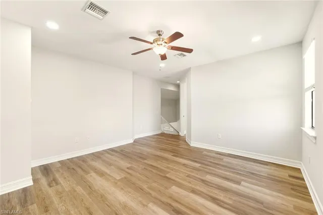 a spacious bathroom with a tub sink shower and mirror