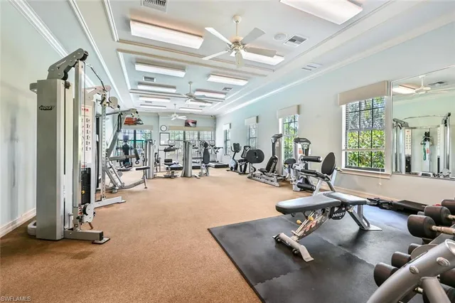 a living room with fireplace furniture and a chandelier