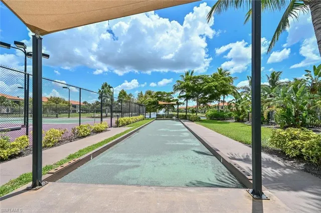 a dining room filled with furniture and a chandelier