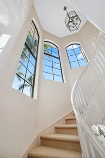 a view of staircase with white walls