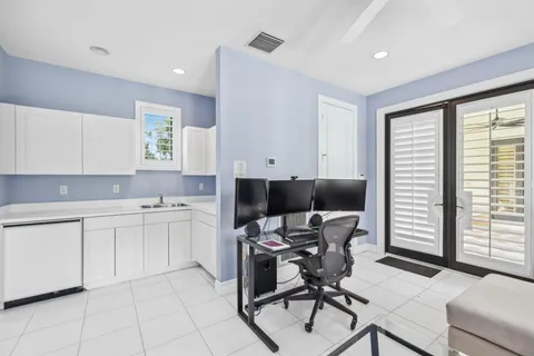 a kitchen with a cabinets and chairs