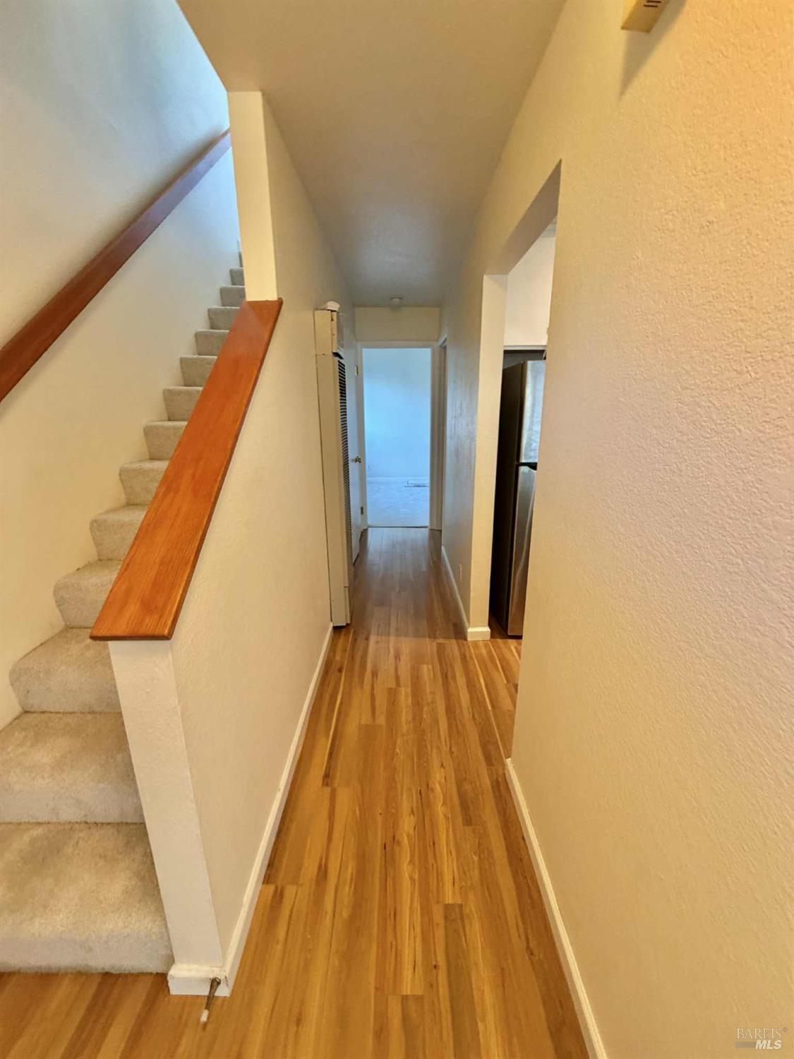 7086 Fircrest Avenue Sebastopol, CA 95472 - Photo 32 of 62 a view of a hallway with wooden floor