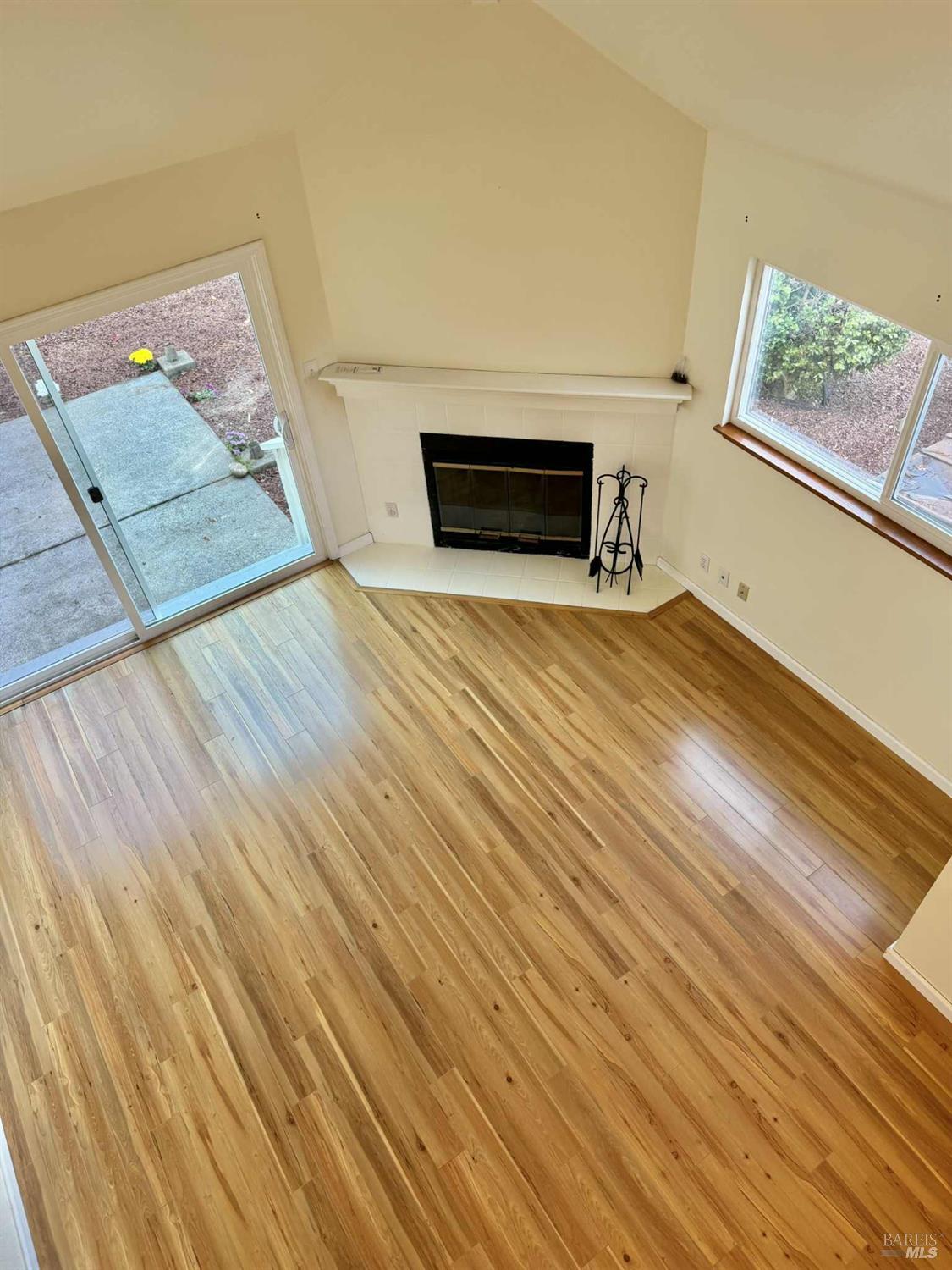 7086 Fircrest Avenue Sebastopol, CA 95472 - Photo 6 of 62 a view of empty room with wooden floor and fireplace