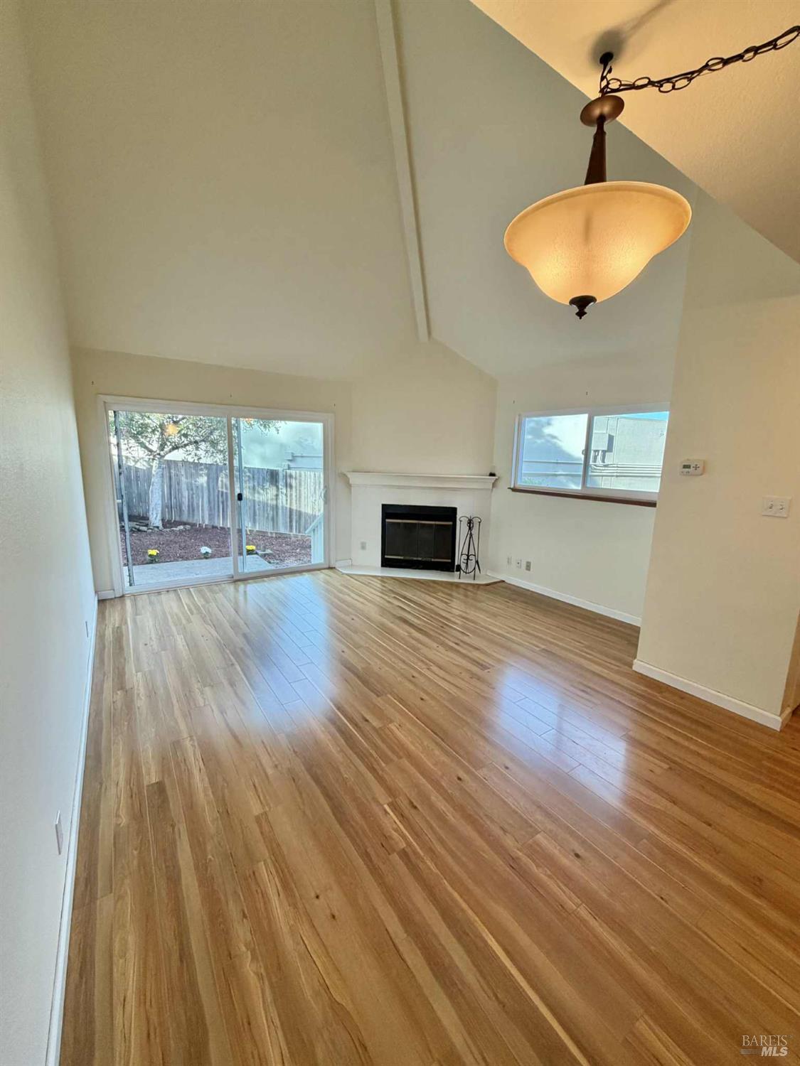 7086 Fircrest Avenue Sebastopol, CA 95472 - Photo 8 of 62 a view of empty room with wooden floor and fan