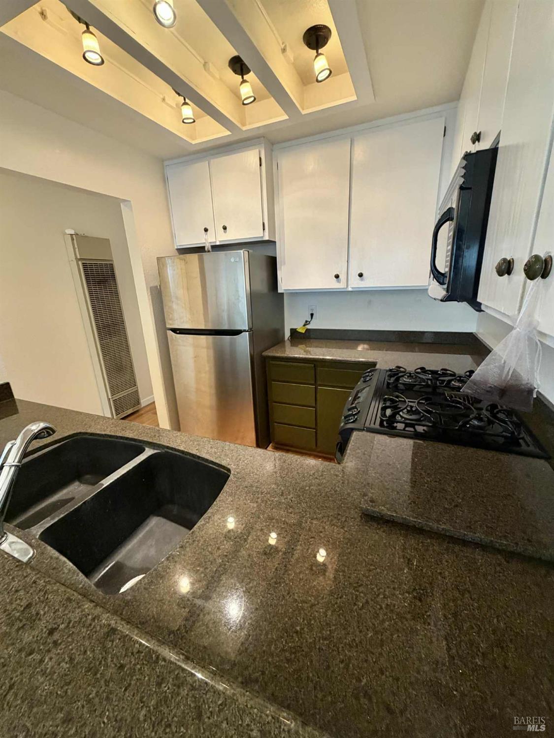 7086 Fircrest Avenue Sebastopol, CA 95472 - Photo 10 of 62 a kitchen with a sink and a refrigerator