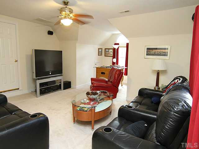 2024 Kinleys Way Raleigh, NC 27613 - Photo 15 of 25 Bonus with ceiling fan and access to huge, unfinished walk-up attic. Bonus Room