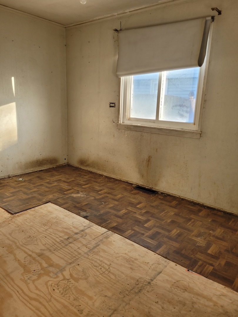 7911 45th Street Lyons, IL 60534 - Photo 13 of 15 a view of an empty room with a window
