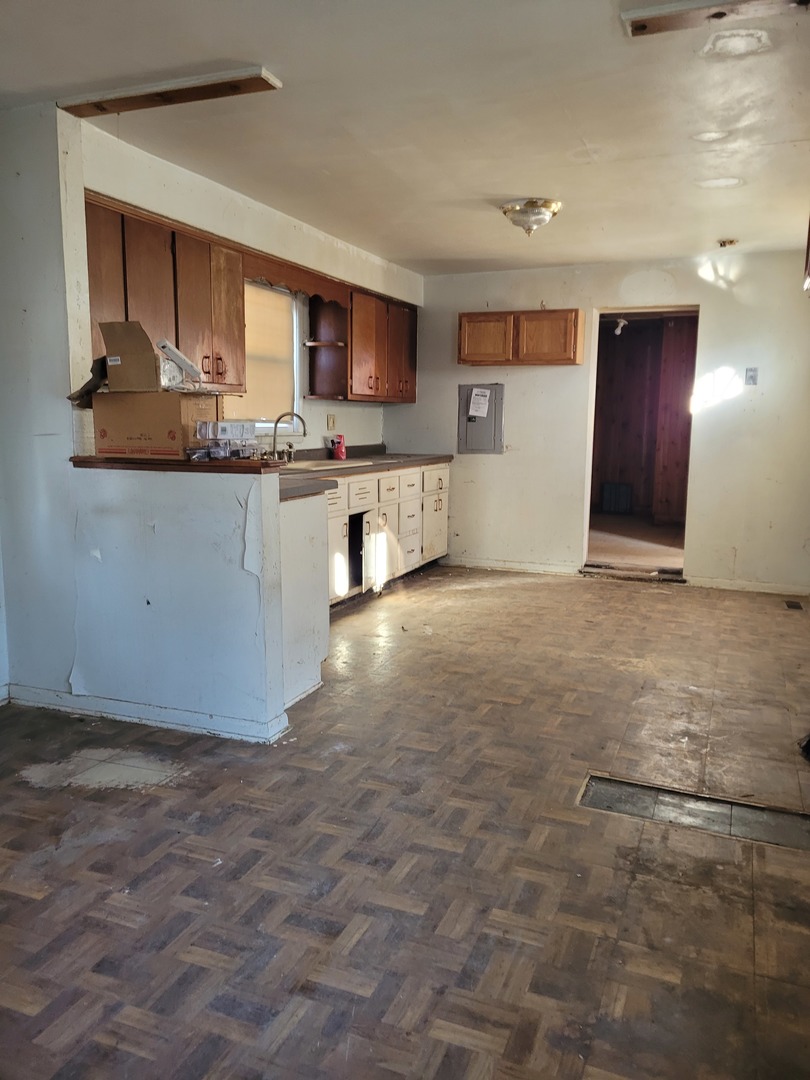 7911 45th Street Lyons, IL 60534 - Photo 14 of 15 a kitchen with stainless steel appliances granite countertop a refrigerator and a stove top oven