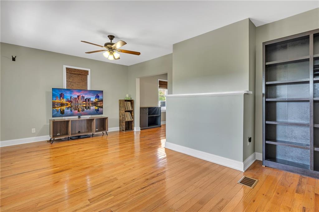 1205 Breitenstein Road Ambridge, PA 15003 - Photo 13 of 25 a view of an empty room with a window and wooden floor