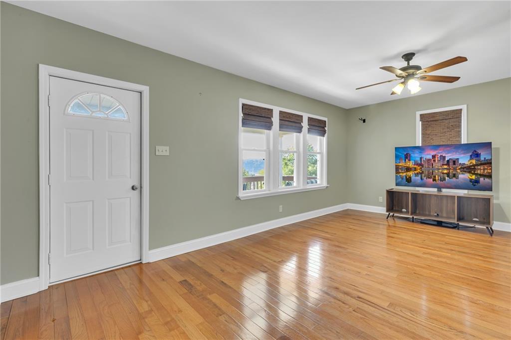 1205 Breitenstein Road Ambridge, PA 15003 - Photo 14 of 25 a view of an empty room with window and wooden floor
