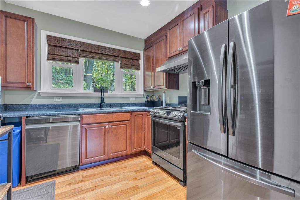 1205 Breitenstein Road Ambridge, PA 15003 - Photo 18 of 25 a kitchen with stainless steel appliances granite countertop a refrigerator sink and stove