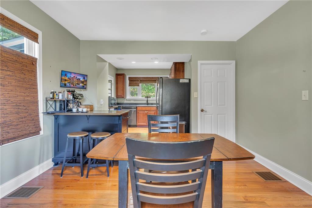 1205 Breitenstein Road Ambridge, PA 15003 - Photo 21 of 25 a dining room with furniture and wooden floor