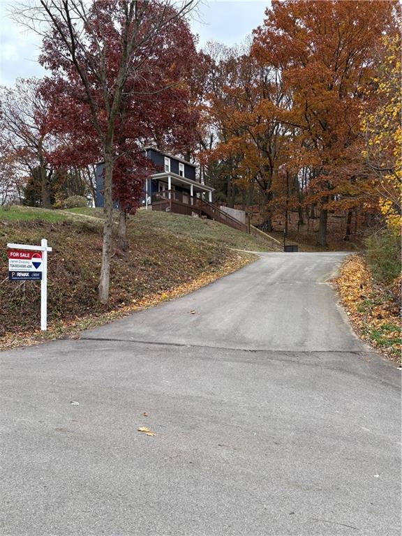 1205 Breitenstein Road Ambridge, PA 15003 - Photo 3 of 25 a view of a yard with plants and trees
