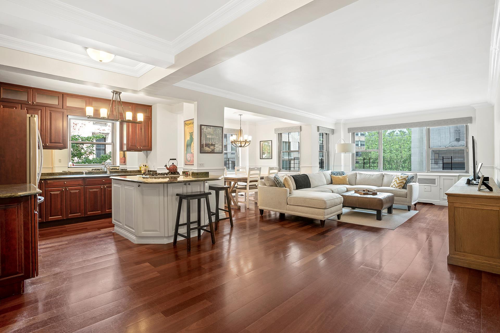 136 East 76th Street, Unit 3D Manhattan, NY 10021 - Photo 2 of 12 a living room with furniture and a large window