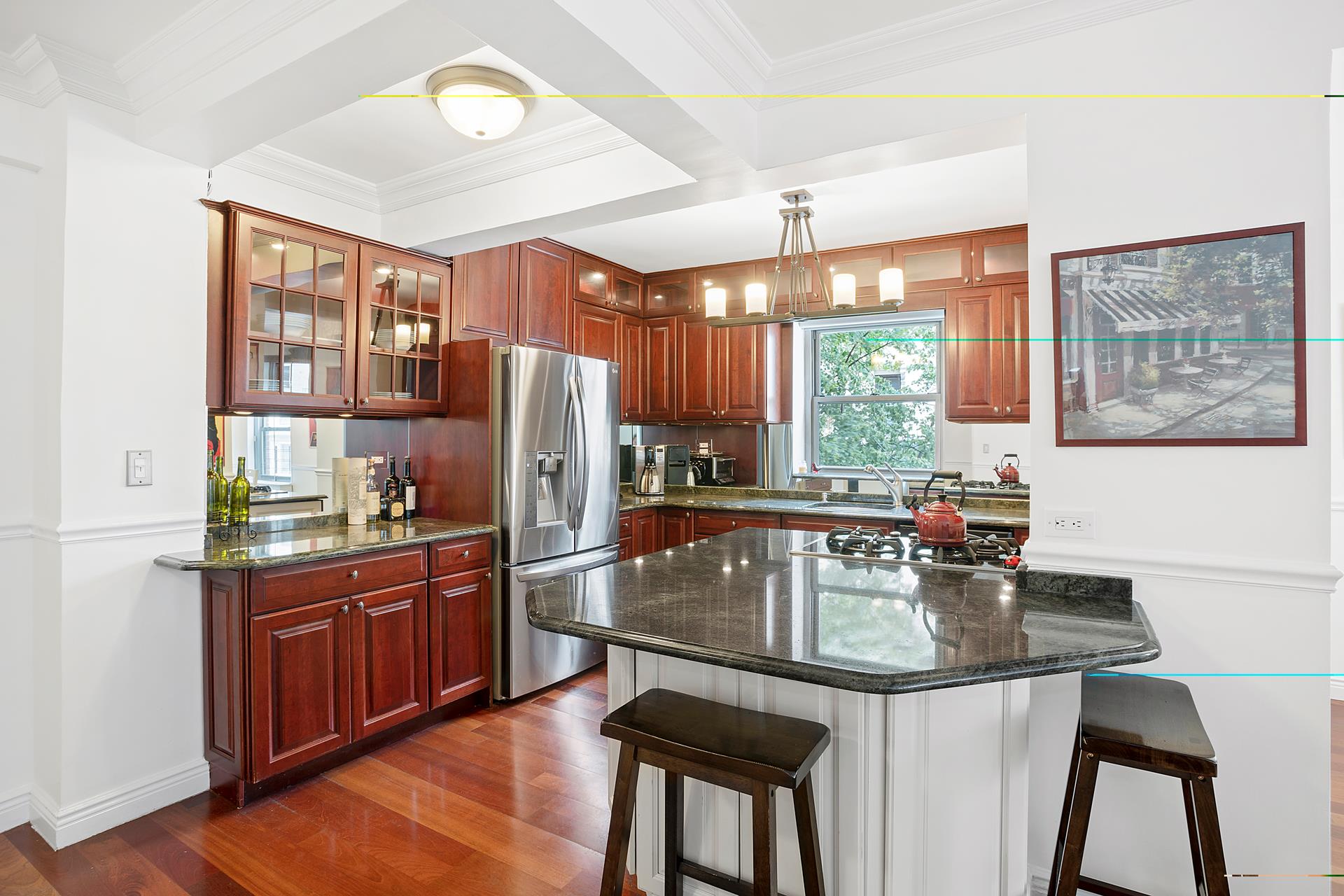 136 East 76th Street, Unit 3D Manhattan, NY 10021 - Photo 3 of 12 a kitchen with stainless steel appliances granite countertop a sink a stove and refrigerator