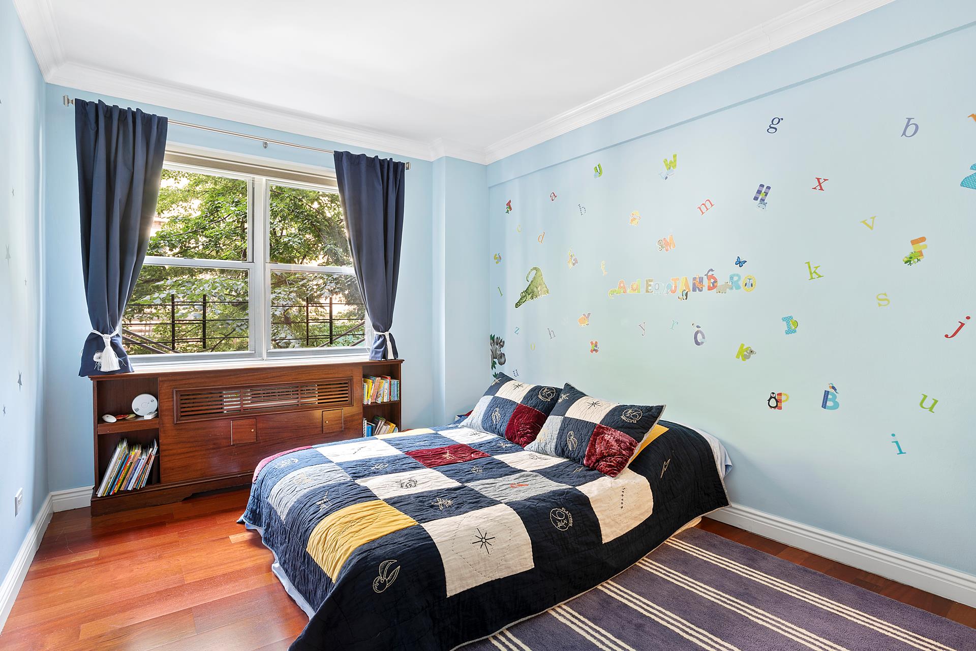 136 East 76th Street, Unit 3D Manhattan, NY 10021 - Photo 8 of 12 a bedroom with a bed and a window